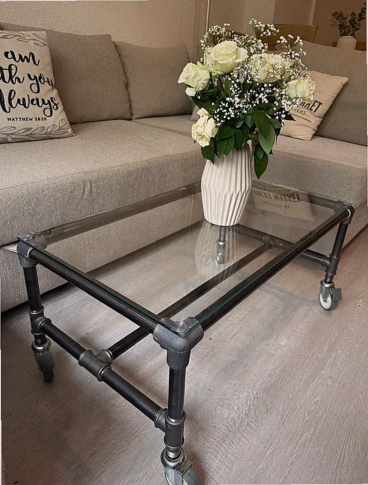 Couchtisch Industrial Glasplatte Metallgestell auf Rollen 87x45x46cm