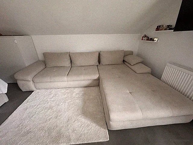 Eckcouch von XXXLutz mit Schlaffunktion und Bettkasten, inklusive Couchkissen